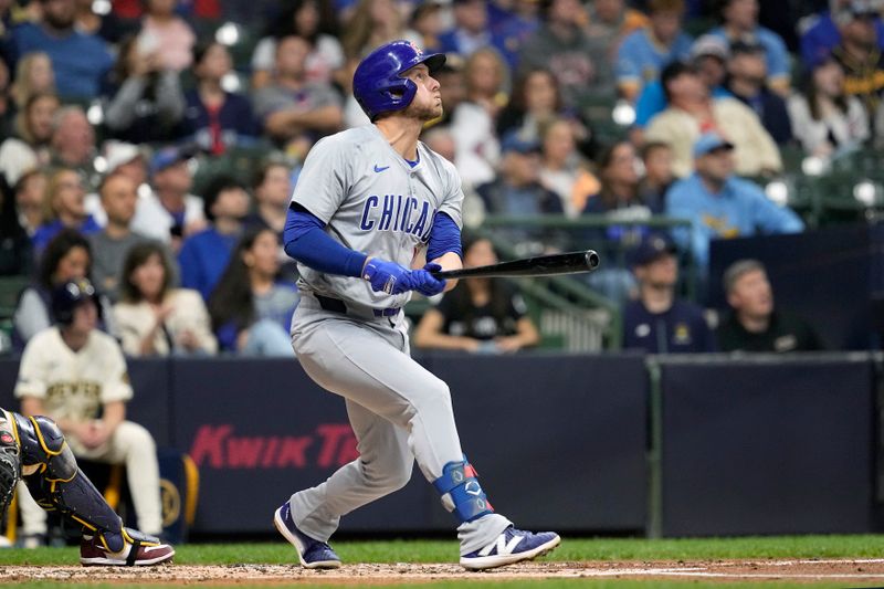 May 28, 2024; Milwaukee, Wisconsin, USA;  Chicago Cubs first baseman Michael Busch (29) hits a home run during the third inning against the Milwaukee Brewers at American Family Field. Mandatory Credit: Jeff Hanisch-USA TODAY Sports