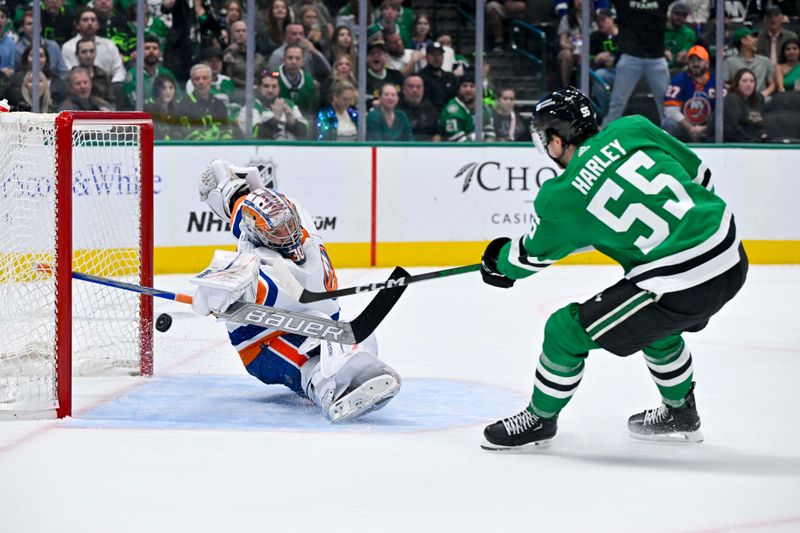 Feb 26, 2024; Dallas, Texas, USA; New York Islanders goaltender Ilya Sorokin (30) stops a breakaway shot by Dallas Stars defenseman Thomas Harley (55) during the second period at the American Airlines Center. Mandatory Credit: Jerome Miron-USA TODAY Sports
