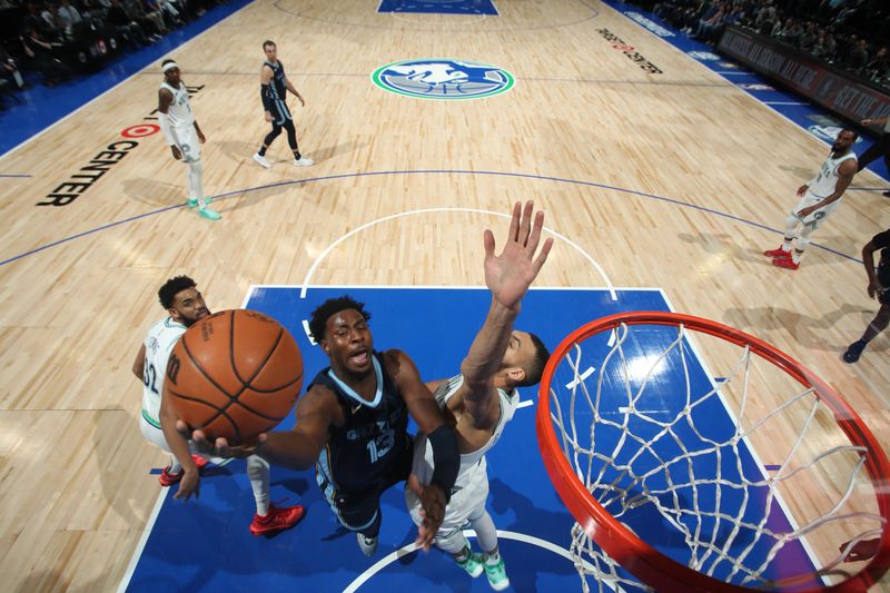 MINNEAPOLIS, MN -  JANUARY 18: Jaren Jackson Jr. #13 of the Memphis Grizzlies drives to the basket during the game against the Minnesota Timberwolves on January 18, 2024 at Target Center in Minneapolis, Minnesota. NOTE TO USER: User expressly acknowledges and agrees that, by downloading and or using this Photograph, user is consenting to the terms and conditions of the Getty Images License Agreement. Mandatory Copyright Notice: Copyright 2024 NBAE (Photo by Jordan Johnson/NBAE via Getty Images)