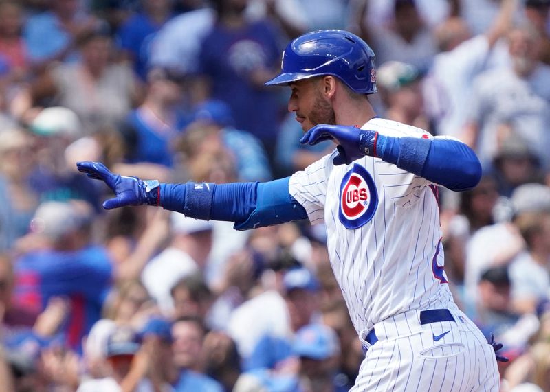 Aug 19, 2023; Chicago, Illinois, USA; Chicago Cubs first baseman gestures Cody Bellinger (24) after hitting a home run against the Kansas City Royals during the third inning at Wrigley Field. Mandatory Credit: David Banks-USA TODAY Sports