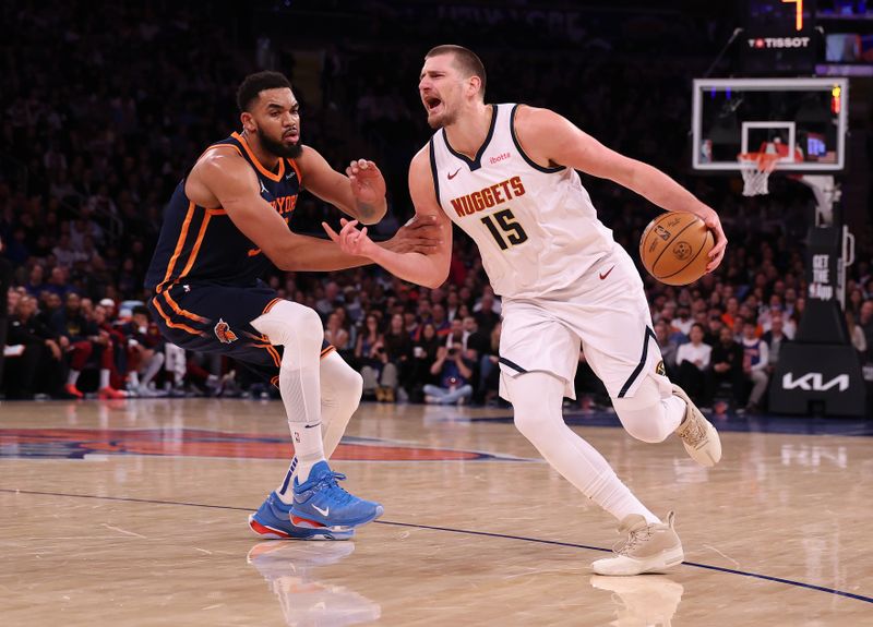 NEW YORK, NEW YORK - JANUARY 29:  Nikola Jokic #15 of the Denver Nuggets is fouled by Karl-Anthony Towns #32 of the New York Knicks during their game at Madison Square Garden on January 29, 2025 in New York City.  User expressly acknowledges and agrees that, by downloading and or using this photograph, User is consenting to the terms and conditions of the Getty Images License Agreement.    (Photo by Al Bello/Getty Images)