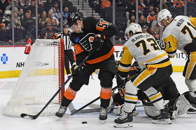 Feb 25, 2025; Philadelphia, Pennsylvania, USA; Philadelphia Flyers defenseman Rasmus Ristolainen (55) and Pittsburgh Penguins left wing Anthony Beauvillier (72) battle for the puck during the first period at Wells Fargo Center. Mandatory Credit: Eric Hartline-Imagn Images