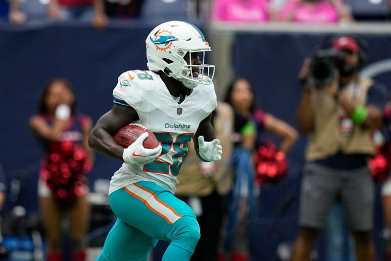 Miami Dolphins' De'Von Achane returns the opening kickoff from the Houston Texans during the first half of an NFL preseason football game, Saturday, Aug. 19, 2023, in Houston. (AP Photo/Eric Gay)