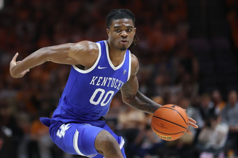 Jan 28, 2025; Knoxville, Tennessee, USA; Kentucky Wildcats guard Otega Oweh (00) moves the ball against the Tennessee Volunteers during the second half at Thompson-Boling Arena at Food City Center. Mandatory Credit: Randy Sartin-Imagn Images