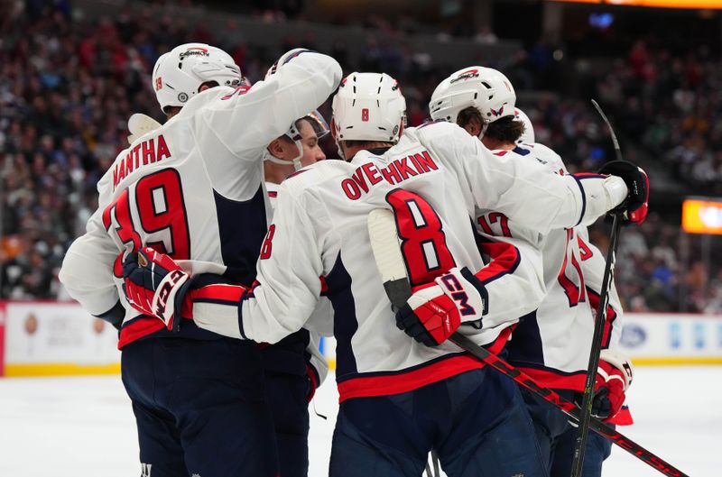 Jan 24, 2023; Denver, Colorado, USA; Washington Capitals left wing Alex Ovechkin (8) celebrates his third period goal with right wing Anthony Mantha (39) and center Dylan Strome (17) against the Colorado Avalanche at Ball Arena. Mandatory Credit: Ron Chenoy-USA TODAY Sports