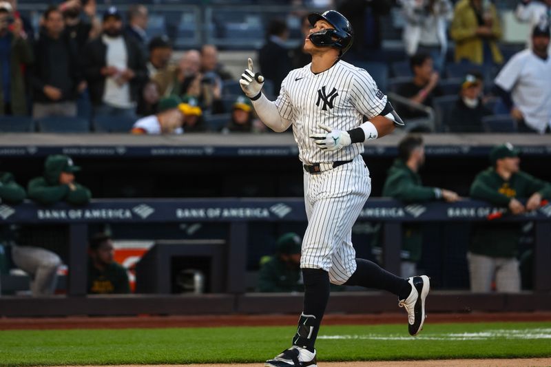 Apr 24, 2024; Bronx, New York, USA; New York Yankees center fielder Aaron Judge (99) gestures after hitting a two run home run in the first inning against the Oakland Athletics at Yankee Stadium. Mandatory Credit: Wendell Cruz-USA TODAY Sports