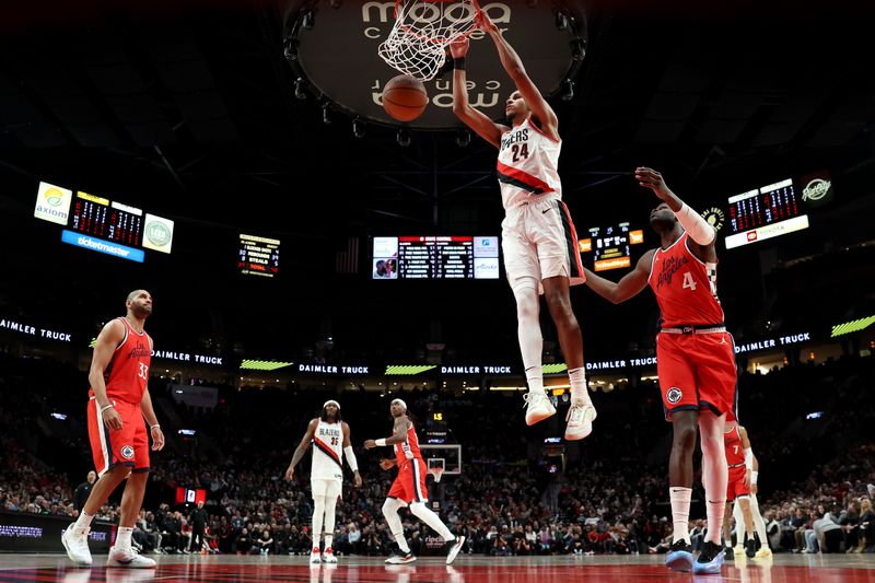 PORTLAND, OREGON - JANUARY 16: Kris Murray #24 of the Portland Trail Blazers dunks during the second half against the LA Clippers at Moda Center on January 16, 2025 in Portland, Oregon. NOTE TO USER: User expressly acknowledges and agrees that, by downloading and or using this photograph, User is consenting to the terms and conditions of the Getty Images License Agreement. (Photo by Steph Chambers/Getty Images)