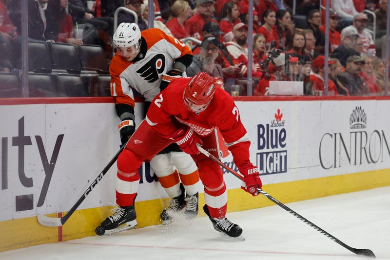 Jan 25, 2024; Detroit, Michigan, USA;  Detroit Red Wings defenseman Olli Maatta (2) and Philadelphia Flyers right wing Tyson Foerster (71) battle for the puck in the first period at Little Caesars Arena. Mandatory Credit: Rick Osentoski-USA TODAY Sports