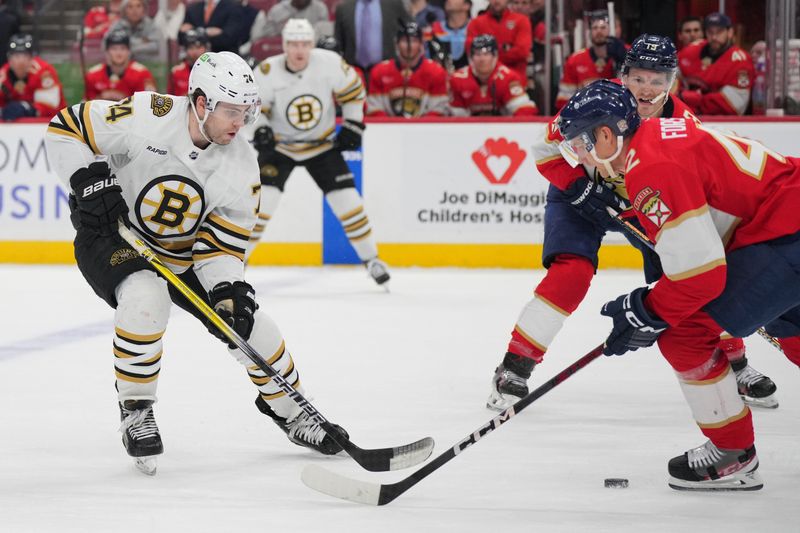 Mar 26, 2024; Sunrise, Florida, USA; Boston Bruins defenseman Brandon Carlo (25) and Florida Panthers defenseman Gustav Forsling (42) battle for a loose puck in the first period at Amerant Bank Arena. Mandatory Credit: Jim Rassol-USA TODAY Sports