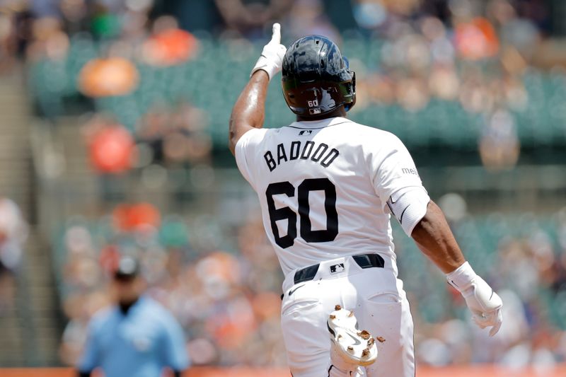 Jun 23, 2024; Detroit, Michigan, USA;  Detroit Tigers center fielder Akil Baddoo (60) celebrates after hitting a two-run home run in the first inning against the Chicago White Sox at Comerica Park. Mandatory Credit: Rick Osentoski-USA TODAY Sports