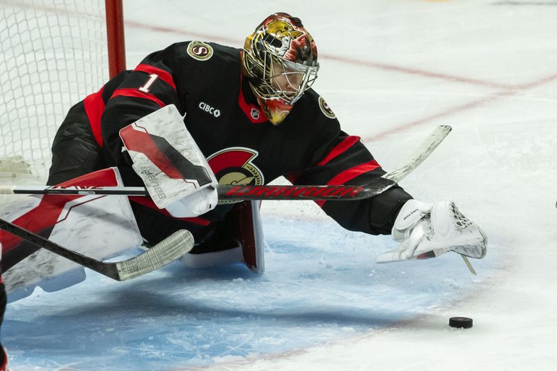 Jan 16, 2025; Ottawa, Ontario, CAN; Ottawa Senators goalie Leevi Merilainen (1) reaches for the puck in the third period against the Washington Capitals at the Canadian Tire Centre. Mandatory Credit: Marc DesRosiers-Imagn Images