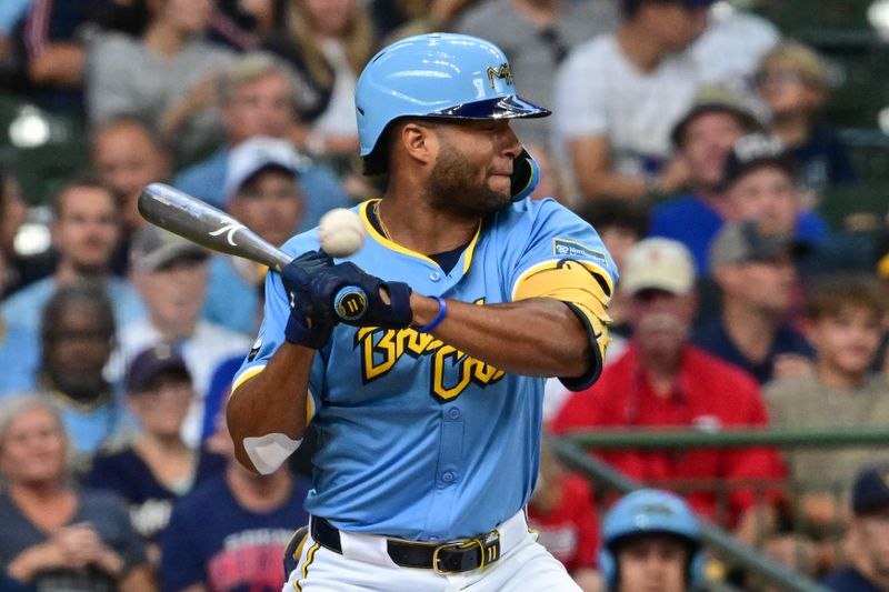 Aug 18, 2024; Milwaukee, Wisconsin, USA; Milwaukee Brewers left fielder Jackson Chourio (11) is hit by a pitch in the third inning against the Cleveland Guardians at American Family Field. Mandatory Credit: Benny Sieu-USA TODAY Sports