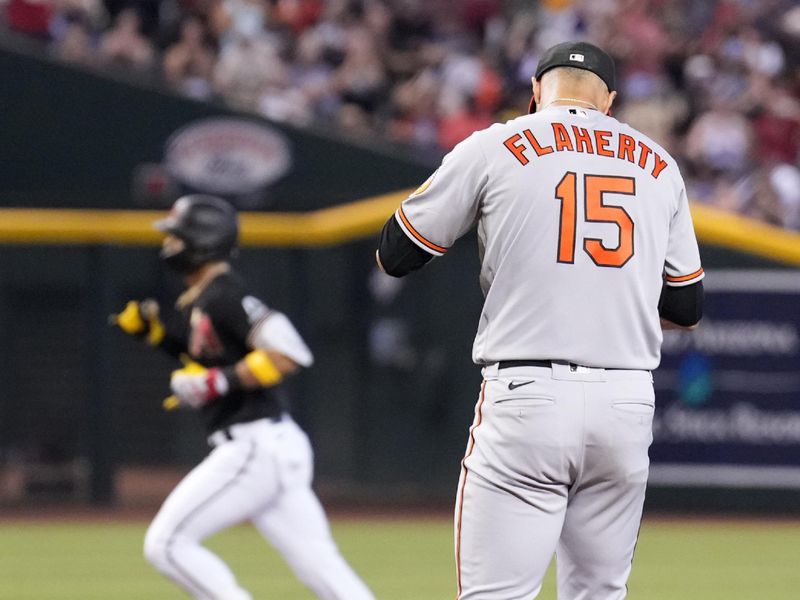 Sep 3, 2023; Phoenix, Arizona, USA; Baltimore Orioles starting pitcher Jack Flaherty (15) reacts after allowing a solo home run to Arizona Diamondbacks left fielder Lourdes Gurriel Jr. (12) during the first inning at Chase Field. Mandatory Credit: Joe Camporeale-USA TODAY Sports