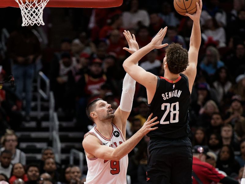 CHICAGO, ILLINOIS - JANUARY 10:  Nikola Vucevic #9 of the Chicago Bulls defends against Alperen Sengun #28 of the Houston Rockets on January 10, 2024 at United Center in Chicago, Illinois.  NOTE TO USER: User expressly acknowledges and agrees that, by downloading and or using this photograph, User is consenting to the terms and conditions of the Getty Images License Agreement.  (Photo by Jamie Sabau/Getty Images)