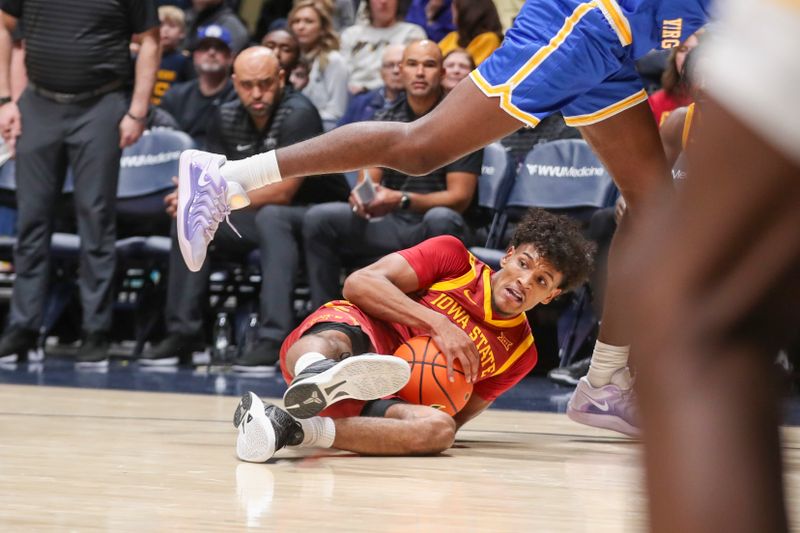 Jan 18, 2025; Morgantown, West Virginia, USA; Iowa State Cyclones guard Curtis Jones (5) dives for a loose ball during the first half against the West Virginia Mountaineers at WVU Coliseum. Mandatory Credit: Ben Queen-Imagn Images