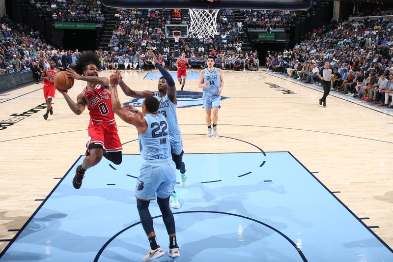 MEMPHIS, TN - OCTOBER 28: Coby White #0 of the Chicago Bulls drives to the basket during the game against the Memphis Grizzlies on October 28, 2024 at FedExForum in Memphis, Tennessee. NOTE TO USER: User expressly acknowledges and agrees that, by downloading and or using this photograph, User is consenting to the terms and conditions of the Getty Images License Agreement. Mandatory Copyright Notice: Copyright 2024 NBAE (Photo by Joe Murphy/NBAE via Getty Images)