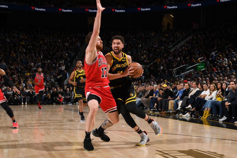 SAN FRANCISCO, CA - MARCH 7:  Klay Thompson #11 of the Golden State Warriors handles the ball during the game against the Chicago Bulls on March 7, 2024 at Chase Center in San Francisco, California. NOTE TO USER: User expressly acknowledges and agrees that, by downloading and or using this photograph, user is consenting to the terms and conditions of Getty Images License Agreement. Mandatory Copyright Notice: Copyright 2024 NBAE (Photo by Noah Graham/NBAE via Getty Images)