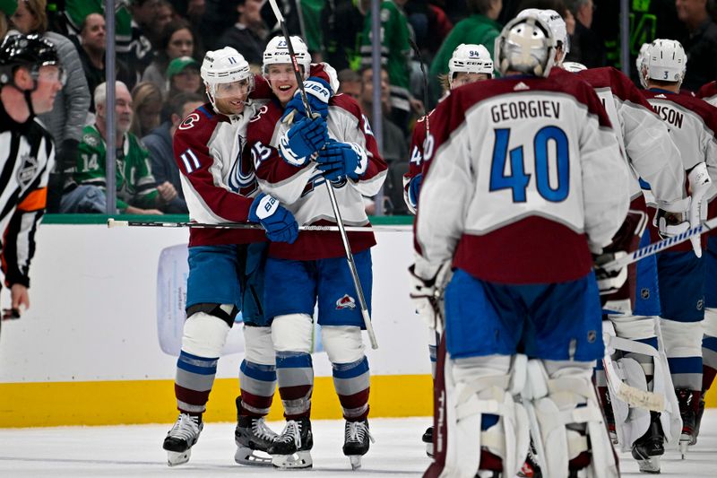 Jan 4, 2024; Dallas, Texas, USA; Colorado Avalanche center Andrew Cogliano (11) and right wing Logan O'Connor (25) and goaltender Alexandar Georgiev (40) celebrates the game winning goal scored by center Nathan MacKinnon (29) during the overtime period against the Dallas Stars at the American Airlines Center. Mandatory Credit: Jerome Miron-USA TODAY Sports