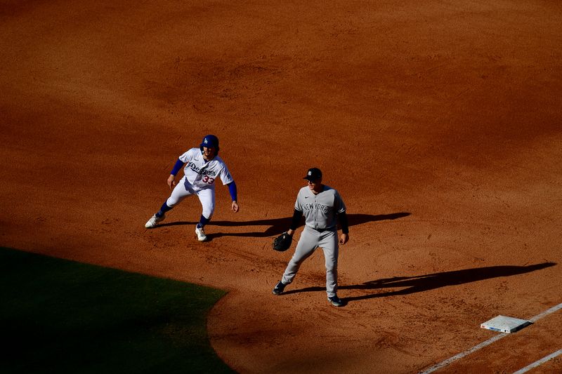 Jun 4, 2023; Los Angeles, California, USA; Los Angeles Dodgers center fielder James Outman (33) leads off from first against New York Yankees first baseman Anthony Rizzo (48) during the sixth inning at Dodger Stadium. Mandatory Credit: Gary A. Vasquez-USA TODAY Sports