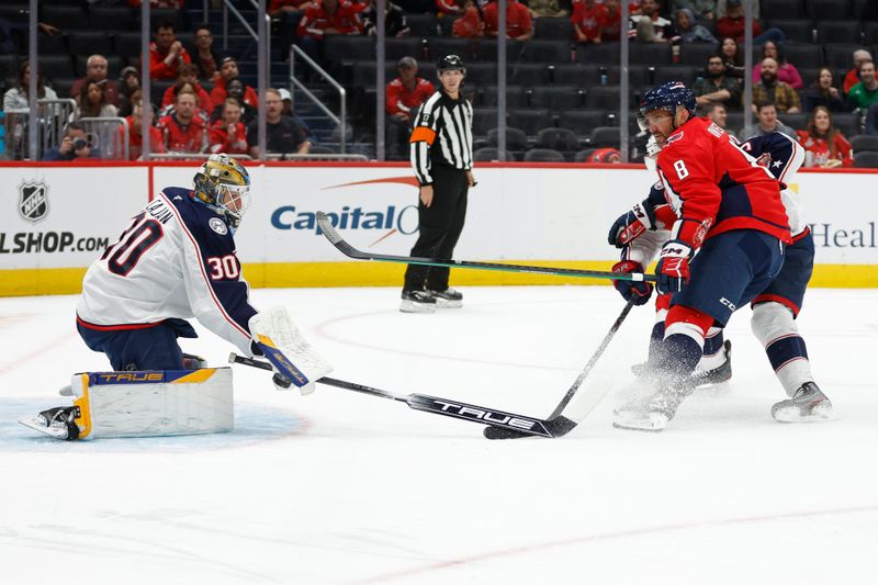 Sep 27, 2024; Washington, District of Columbia, USA; Washington Capitals left wing Alex Ovechkin (8) skates with the puck on Columbus Blue Jackets goaltender Pavel Cajan (30) as Blue Jackets defenseman Jack Johnson (3) defends in the third period at Capital One Arena. Mandatory Credit: Geoff Burke-Imagn Images