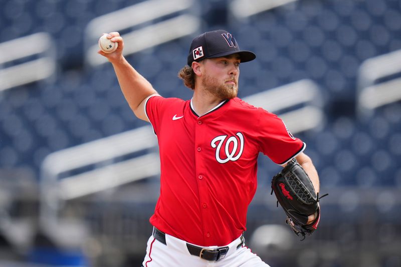 Mar 4, 2025; West Palm Beach, Florida, USA; Washington Nationals pitcher Jake Irvin (27) throws a pitch against the St. Louis Cardinals during the first inning at CACTI Park of the Palm Beaches. Mandatory Credit: Rich Storry-Imagn Images