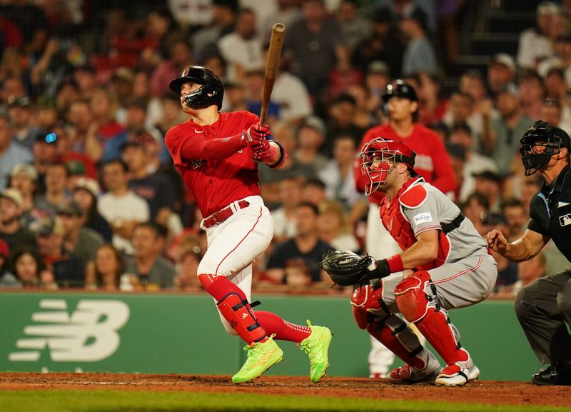 Jun 1, 2023; Boston, Massachusetts, USA; Boston Red Sox shortstop Enrique Hernandez (5) hits a home run against the Cincinnati Reds in the seventh inning at Fenway Park. Mandatory Credit: David Butler II-USA TODAY Sports