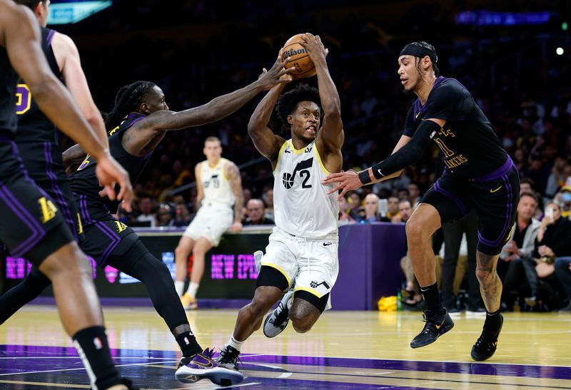 LOS ANGELES, CALIFORNIA - NOVEMBER 21: Collin Sexton #2 of the Utah Jazz drives to basket as he is double teamed by Taurean Prince #12 and Jaxson Hayes #11 of the Los Angeles Lakers during the second half of an NBA In-Season Tournament at Crypto.com Arena on November 21, 2023 in Los Angeles, California. NOTE TO USER: User expressly acknowledges and agrees that, by downloading and or using this photograph, User is consenting to the terms and conditions of the Getty Images License Agreement. (Photo by Kevork Djansezian/Getty Images)