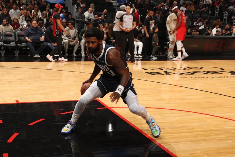 MIAMI, FL - NOVEMBER 24: Kyrie Irving #11 of the Dallas Mavericks dribbles the ball during the game against the Miami Heat on November 24, 2024 at Kaseya Center in Miami, Florida. NOTE TO USER: User expressly acknowledges and agrees that, by downloading and or using this Photograph, user is consenting to the terms and conditions of the Getty Images License Agreement. Mandatory Copyright Notice: Copyright 2024 NBAE (Photo by Issac Baldizon/NBAE via Getty Images)