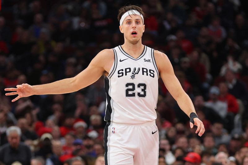 CHICAGO, ILLINOIS - DECEMBER 21: Zach Collins #23 of the San Antonio Spurs celebrates a three pointer against the Chicago Bulls during the first half at the United Center on December 21, 2023 in Chicago, Illinois. NOTE TO USER: User expressly acknowledges and agrees that, by downloading and or using this photograph, User is consenting to the terms and conditions of the Getty Images License Agreement.  (Photo by Michael Reaves/Getty Images)