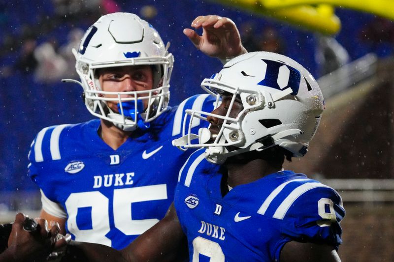 Sep 9, 2023; Durham, North Carolina, USA;  Duke Blue Devils running back Jaquez Moore (9) celebrates his touchdown run with tight end Jeremiah Hasley (85) against the Lafayette Leopards during the second half at Wallace Wade Stadium. Mandatory Credit: James Guillory-USA TODAY Sports