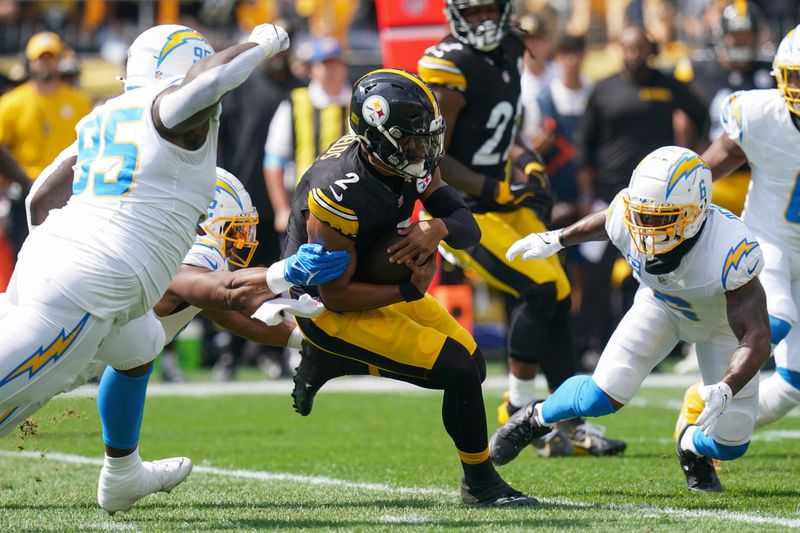 Pittsburgh Steelers quarterback Justin Fields (2) runs with the ball during the first half of an NFL football game against the Los Angeles Chargers, Sunday, Sept. 22, 2024, in Pittsburgh. (AP Photo/Matt Freed)