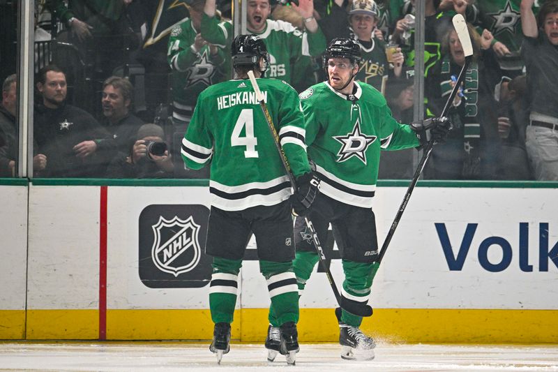 May 5, 2024; Dallas, Texas, USA; Dallas Stars center Radek Faksa (12) and defenseman Miro Heiskanen (4) celebrates the game winning goal scored by Faksa against the Vegas Golden Knights during the third period in game seven of the first round of the 2024 Stanley Cup Playoffs at American Airlines Center. Mandatory Credit: Jerome Miron-USA TODAY Sports