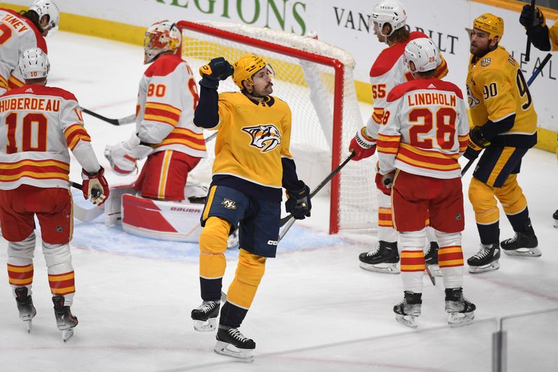 Jan 4, 2024; Nashville, Tennessee, USA; Nashville Predators left wing Filip Forsberg (9) celebrates after a goal during the first period against the Calgary Flames at Bridgestone Arena. Mandatory Credit: Christopher Hanewinckel-USA TODAY Sports