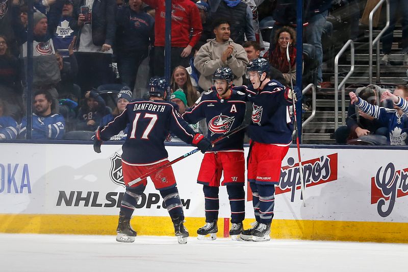 Dec 29, 2023; Columbus, Ohio, USA; Columbus Blue Jackets left wing Johnny Gaudreau (13) celebrates his over time winning goal against the Toronto Maple Leafs at Nationwide Arena. Mandatory Credit: Russell LaBounty-USA TODAY Sports