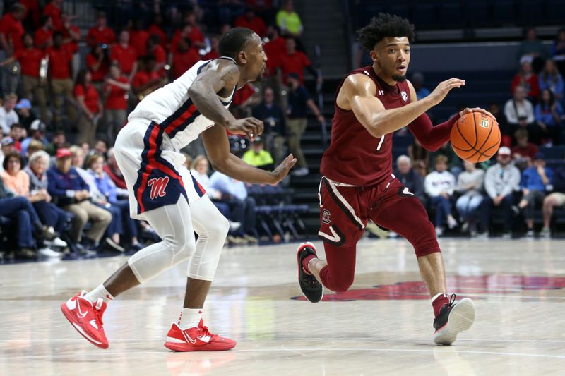 Feb 11, 2023; Oxford, Mississippi, USA; South Carolina Gamecocks guard Jacobi Wright (1) dribbles as Mississippi Rebels guard Tye Fagan (14) defends during the first half at The Sandy and John Black Pavilion at Ole Miss. Mandatory Credit: Petre Thomas-USA TODAY Sports