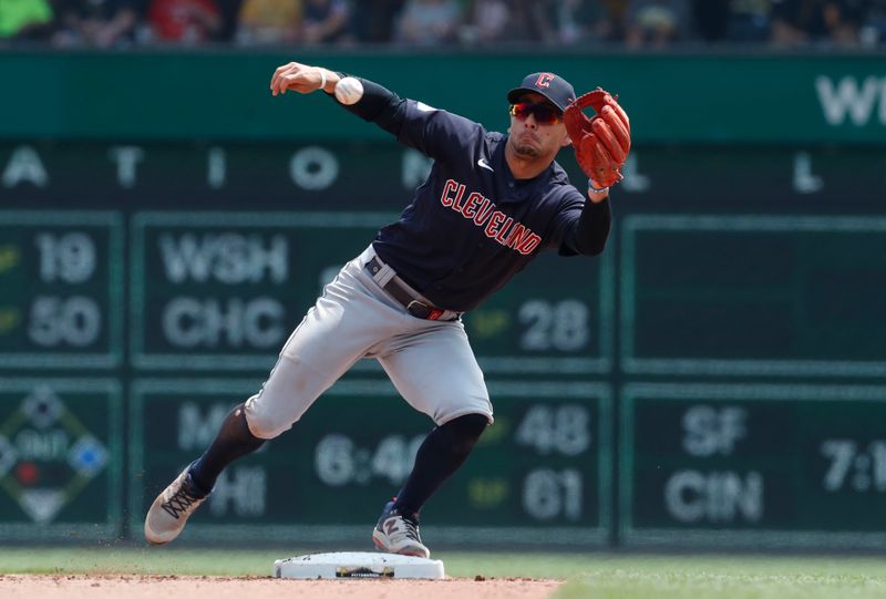 Jul 19, 2023; Pittsburgh, Pennsylvania, USA;  Cleveland Guardians second baseman Andres Gimenez (0) takes a throw for a force out at second base against the Pittsburgh Pirates during the seventh inning at PNC Park. The Pirates won 7-5. Mandatory Credit: Charles LeClaire-USA TODAY Sports