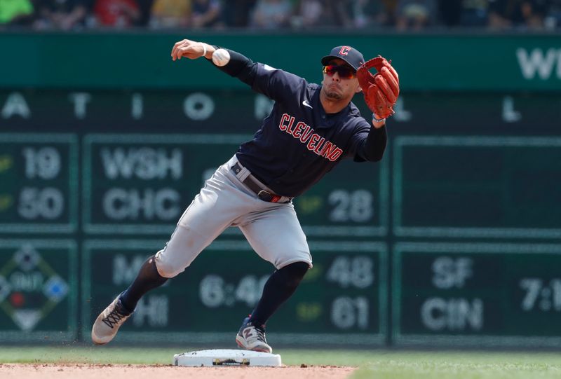 Jul 19, 2023; Pittsburgh, Pennsylvania, USA;  Cleveland Guardians second baseman Andres Gimenez (0) takes a throw for a force out at second base against the Pittsburgh Pirates during the seventh inning at PNC Park. The Pirates won 7-5. Mandatory Credit: Charles LeClaire-USA TODAY Sports