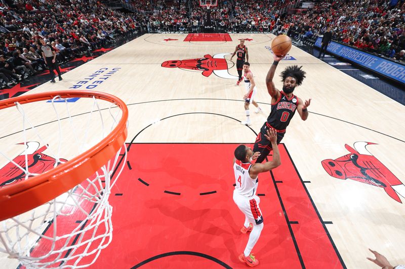 CHICAGO, IL - MARCH 25: Coby White #0 of the Chicago Bulls shoots the ball during the game against the Washington Wizards  on March 25, 2024 at United Center in Chicago, Illinois. NOTE TO USER: User expressly acknowledges and agrees that, by downloading and or using this photograph, User is consenting to the terms and conditions of the Getty Images License Agreement. Mandatory Copyright Notice: Copyright 2024 NBAE (Photo by Jeff Haynes/NBAE via Getty Images)