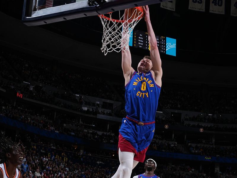 DENVER, CO - MARCH 5: Christian Braun #0 of the Denver Nuggets dunks the ball during the game against the Phoenix Suns on March 5, 2024 at the Ball Arena in Denver, Colorado. NOTE TO USER: User expressly acknowledges and agrees that, by downloading and/or using this Photograph, user is consenting to the terms and conditions of the Getty Images License Agreement. Mandatory Copyright Notice: Copyright 2024 NBAE (Photo by Garrett Ellwood/NBAE via Getty Images)