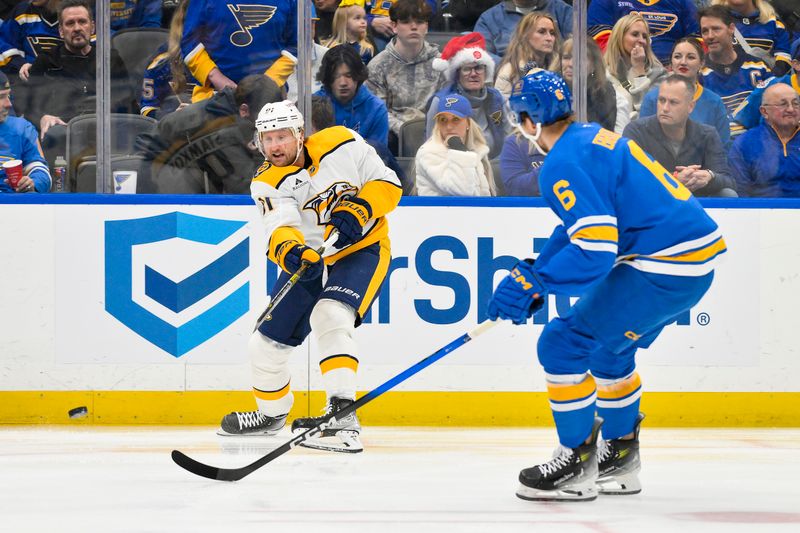 Dec 27, 2025; St. Louis, Missouri, USA; Nashville Predators center Steven Stamkos (91) passes the puck past St. Louis Blues defenseman Philip Broberg (6) during the first period at Enterprise Center. Mandatory Credit: Jeff Curry-Imagn Images