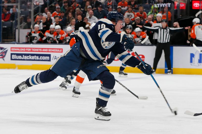 Jan 14, 2025; Columbus, Ohio, USA; Columbus Blue Jackets left wing Dmitri Voronkov (10) takes a shot against the Philadelphia Flyers during the first period at Nationwide Arena. Mandatory Credit: Russell LaBounty-Imagn Images