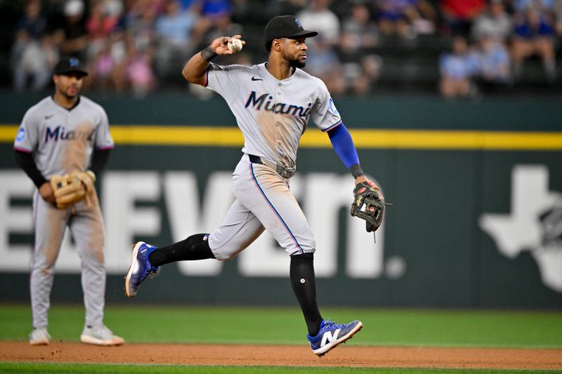 Sep 21, 2025; Arlington, Texas, USA; Miami Marlins shortstop Otto Lopez (6) throw to first base during the seventh inning against the Texas Rangers at Globe Life Field. Mandatory Credit: Jerome Miron-Imagn Images