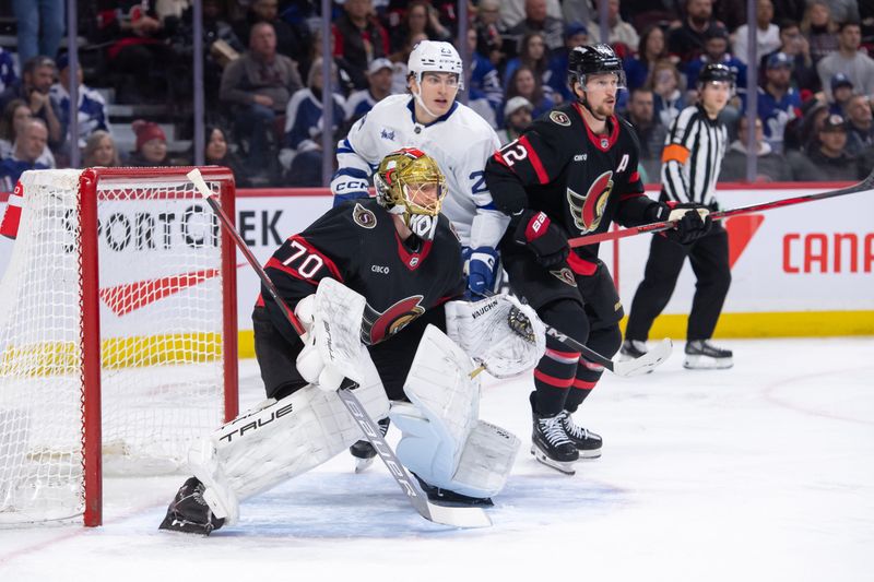 Feb 10, 2024; Ottawa, Ontario, CAN; Toronto Maple Leafs left wing Matthew Knies (23) jockeys for position with Ottawa Senators goalie Joonas Korpisalo (70) and defenseman Thomas Chabot (72) in the second period at the Canadian Tire Centre. Mandatory Credit: Marc DesRosiers-USA TODAY Sports