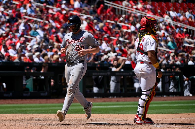 May 21, 2025; St. Louis, Missouri, USA;  Detroit Tigers first baseman Spencer Torkelson (20) scores against the St. Louis Cardinals during the eighth inning at Busch Stadium. Mandatory Credit: Jeff Curry-Imagn Images