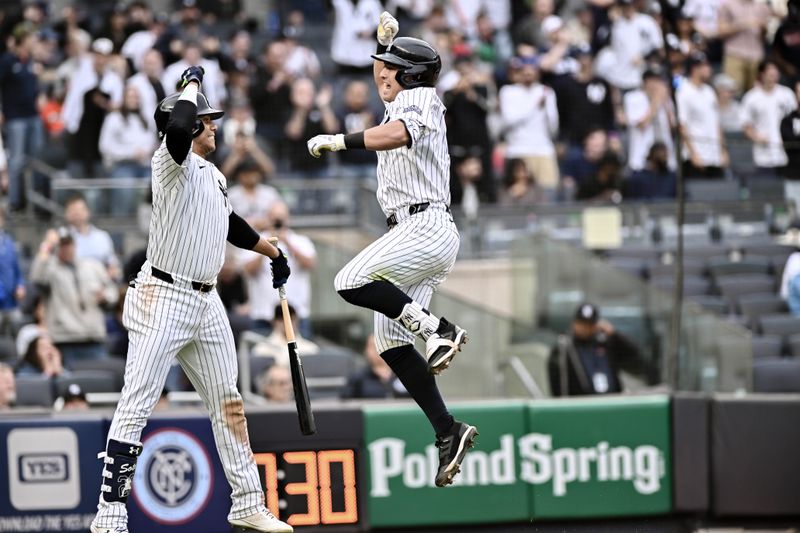 May 9, 2024; Bronx, New York, USA; New York Yankees shortstop Anthony Volpe (11) is greeted at home plate by outfielder Juan Soto (22) after hitting a two run home run during the third inning against the Houston Astros at Yankee Stadium. Mandatory Credit: John Jones-USA TODAY Sports