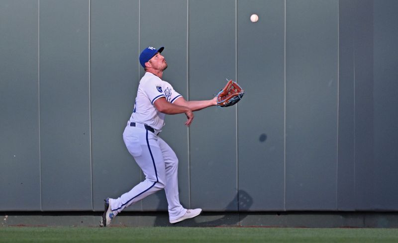 Jun 25, 2024; Kansas City, Missouri, USA; Kansas City Royals right fielder Hunter Renfroe (16) catches a fly ball in the first inning against the Miami Marlins at Kauffman Stadium. Mandatory Credit: Peter Aiken-USA TODAY Sports