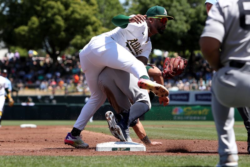 May 10, 2025; West Sacramento, California, USA; New York Yankees short stop Anthony Volpe (11) is tagged out at third base by Athletics third baseman Miguel Andujar (22) during the second inning at Sutter Health Park. Mandatory Credit: Dennis Lee-Imagn Images