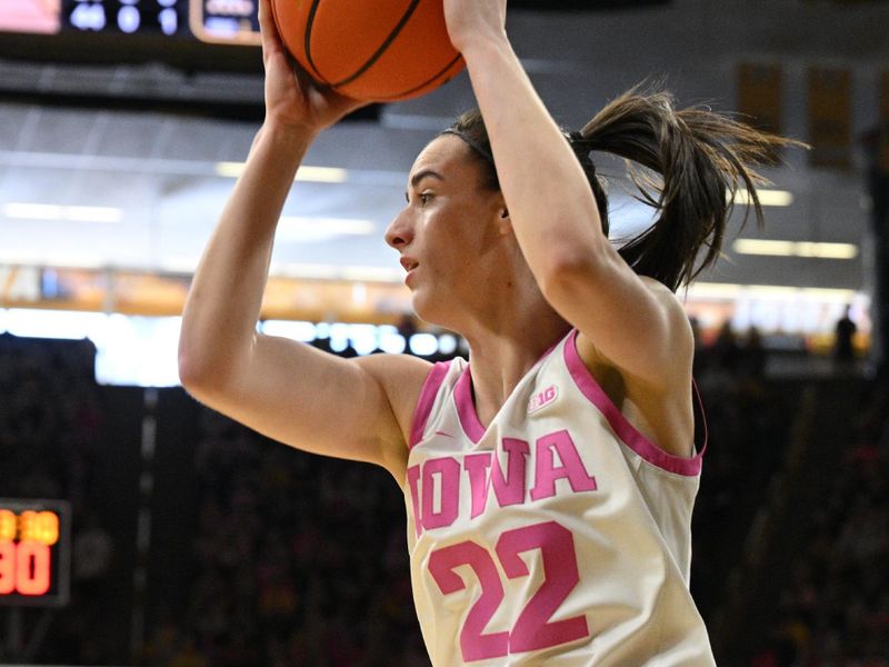 Feb 25, 2024; Iowa City, Iowa, USA; Iowa Hawkeyes guard Caitlin Clark (22) grabs a rebound against the Illinois Fighting Illini during the first quarter at Carver-Hawkeye Arena. Mandatory Credit: Jeffrey Becker-USA TODAY Sports