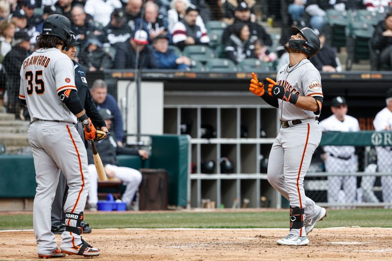 Apr 3, 2023; Chicago, Illinois, USA; San Francisco Giants third baseman David Villar (32) crosses home plate after hitting a solo home run against the Chicago White Sox during the fifth inning at Guaranteed Rate Field. Mandatory Credit: Kamil Krzaczynski-USA TODAY Sports