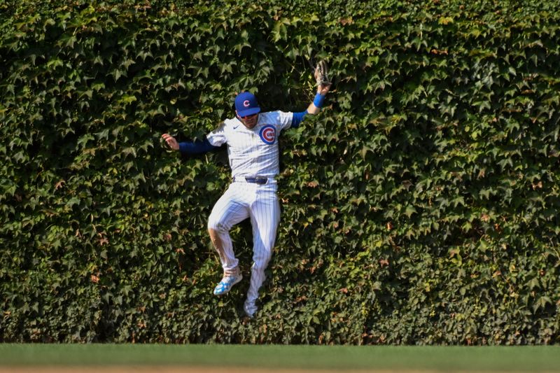 Sep 8, 2024; Chicago, Illinois, USA;  Chicago Cubs outfielder Ian Happ (8) catches a fly ball hit by New York Yankees catcher Austin Wells (28) during the eighth inning at Wrigley Field. Mandatory Credit: Matt Marton-Imagn Images